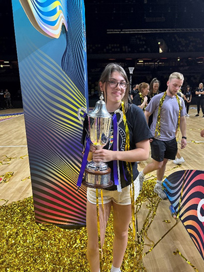 Student holding a trophy